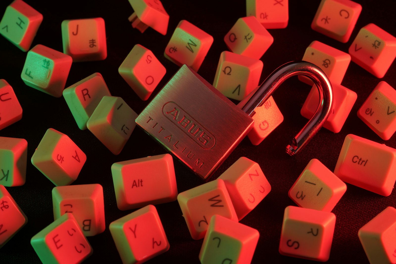 Padlock resting on a computer keyboard, representing data security and HIPAA compliance