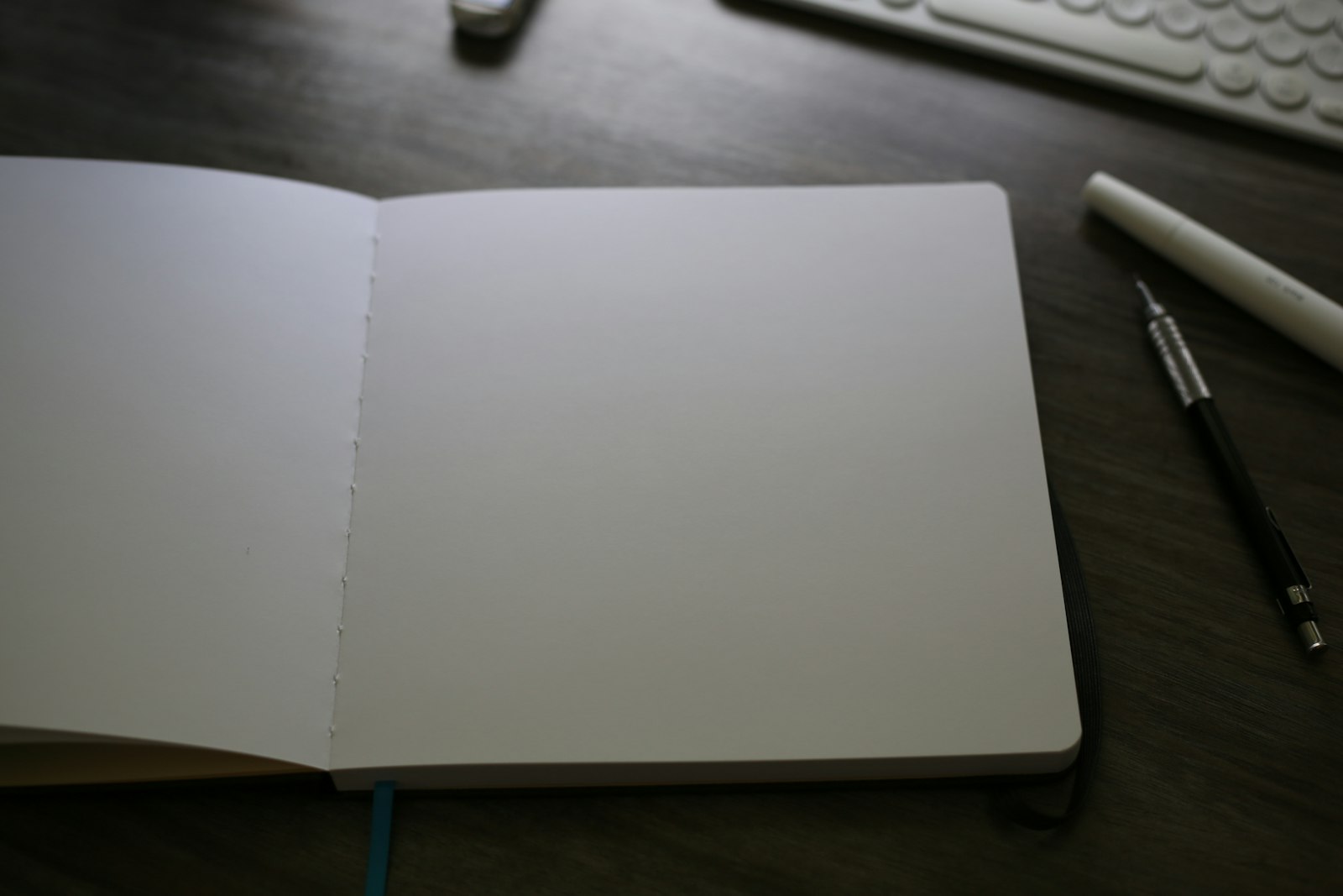Open notebook next to a keyboard, representing law firm content writing and drafting